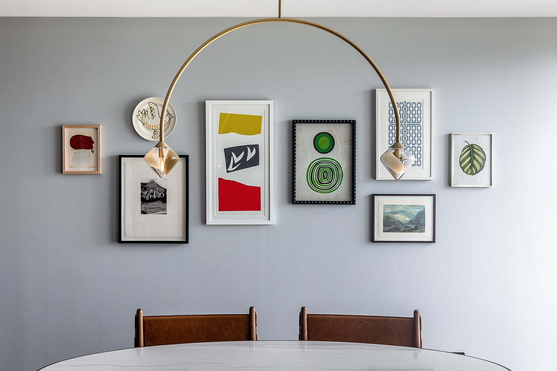 101 on Cleveland | minimalist dining area with colourful wall art | Angel O'Donnell