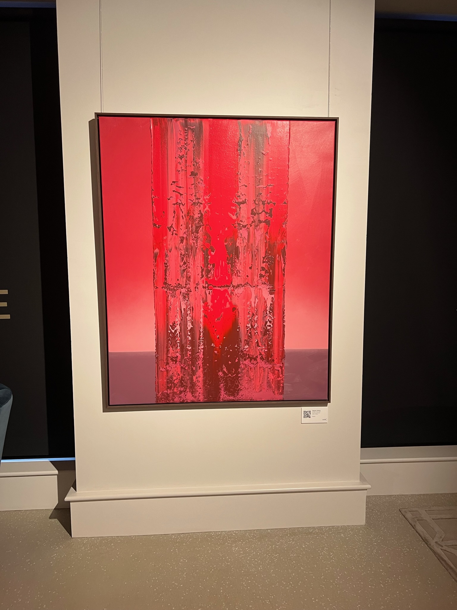 Red abstract painting in art gallery