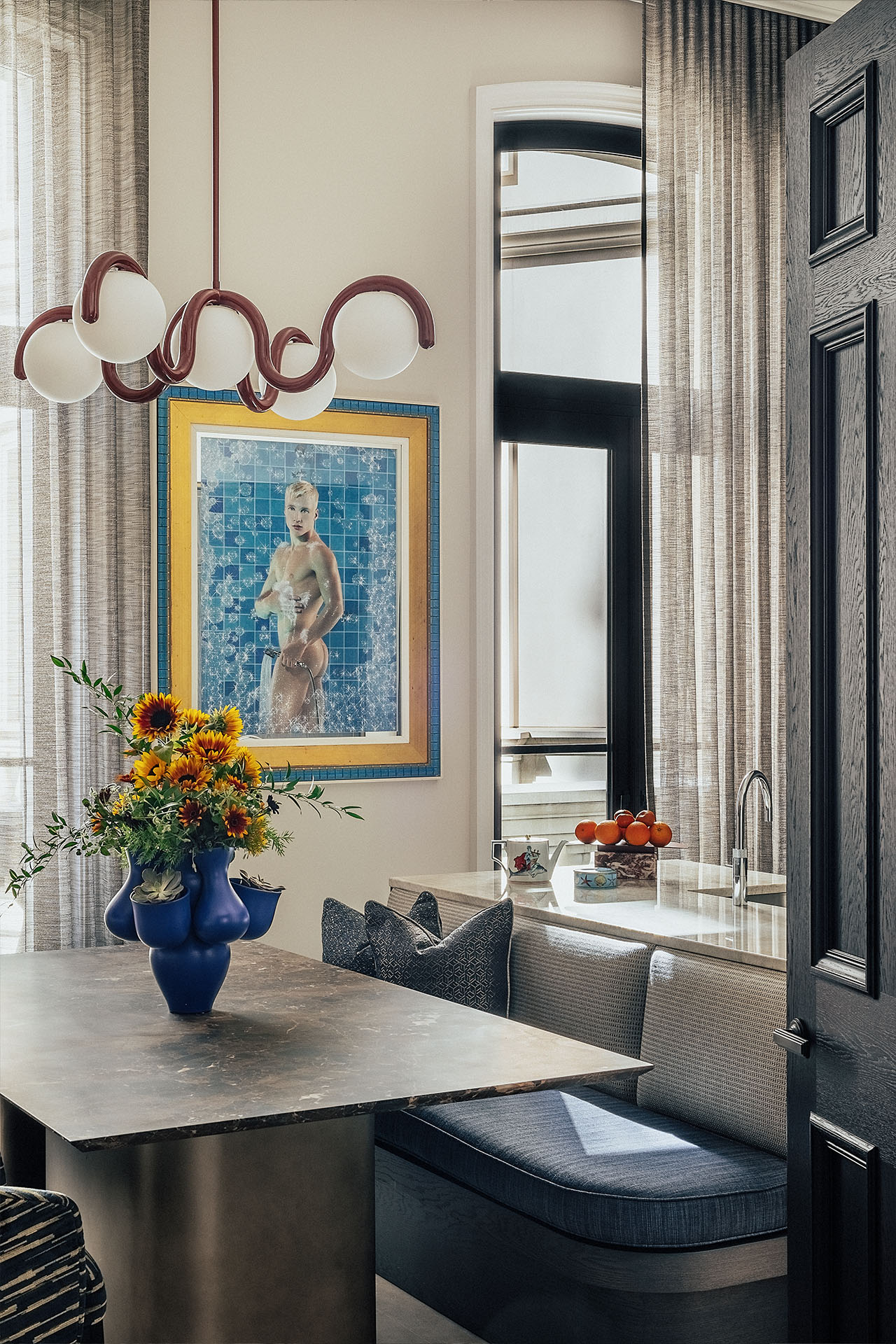 OWO Residences 3 | Vibrant artwork, characterful light fixtures and textured chairs in the kitchen | Whitehall