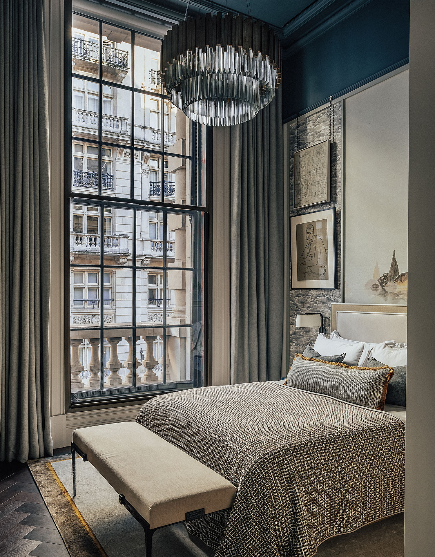 OWO Residences 3 | Warm neutrals and blue accents make up a cosy guest bedroom filled with art | Whitehall