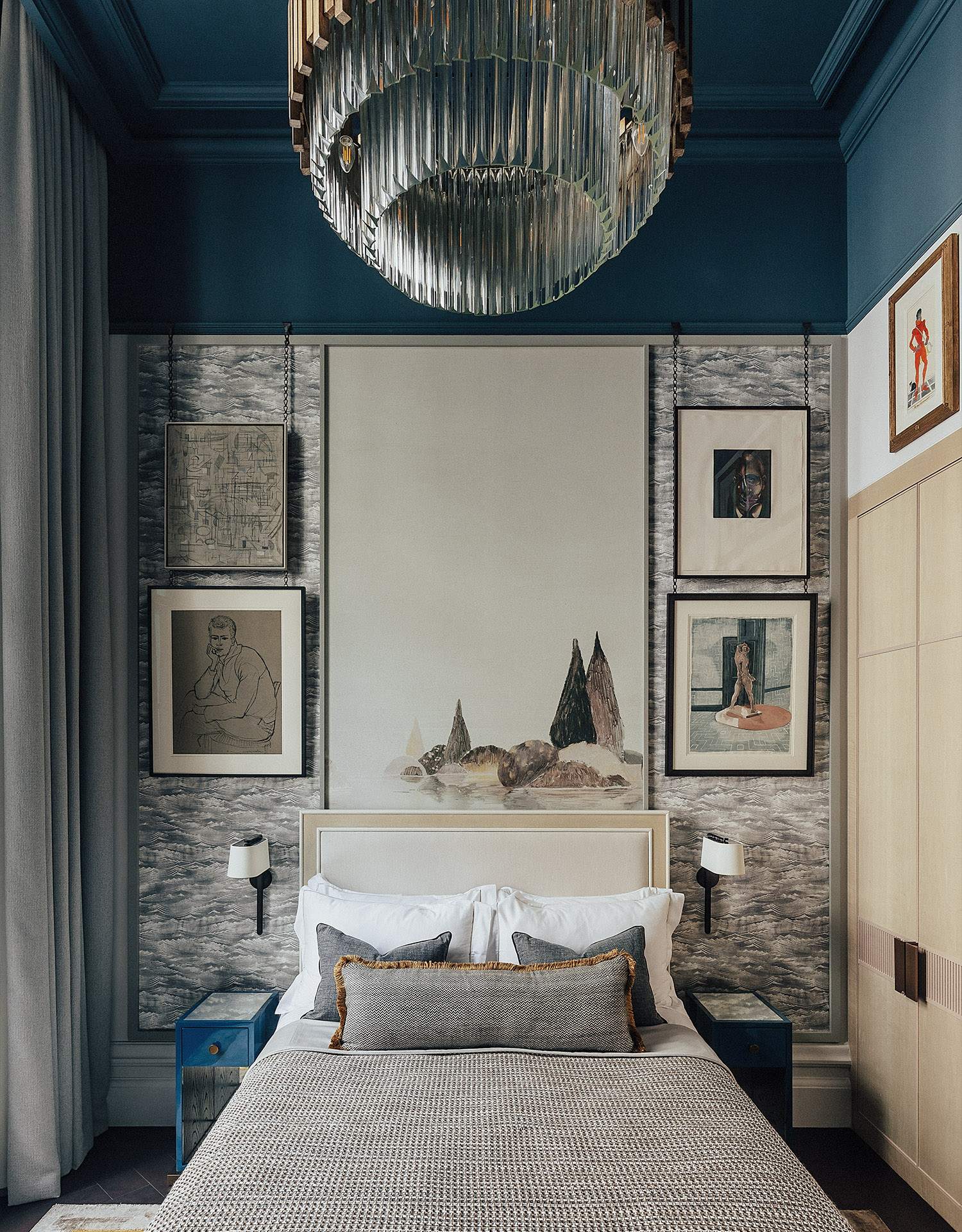 OWO Residences 3 | Warm neutrals and blue accents make up a cosy guest bedroom filled with art | Whitehall